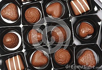 Open box of chocolates Stock Photo