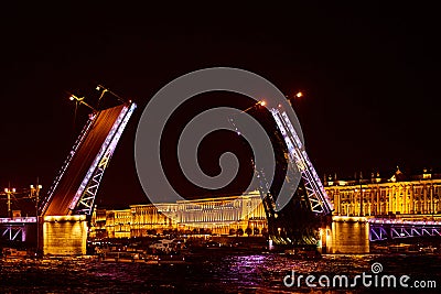 Open bridge over the river in the evening city. Drawbridge in Saint Petersburg with night lights Stock Photo