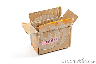 Open cardboard box with a label and barcode. Stock Photo