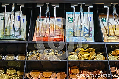 Open cash register drawer closeup with money Stock Photo