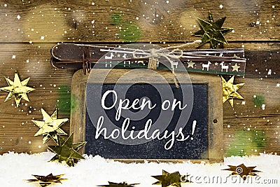 Open on Christmas: sign with text for winter skiing holidays and Stock Photo