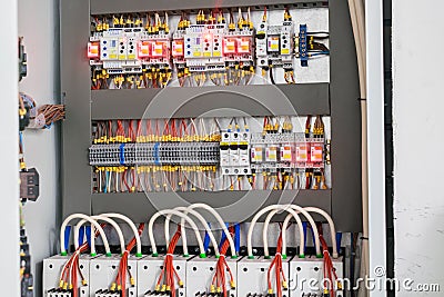 Open control panel for the power supply of the building. A modern electric box contains many wires and devices Editorial Stock Photo