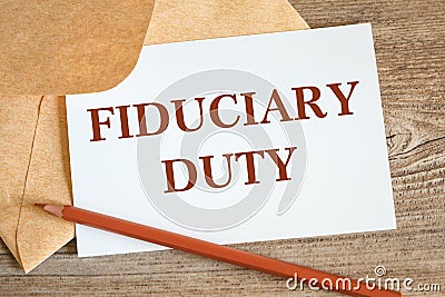 Open craft envelope and card with the words Fiduciary Duty Stock Photo