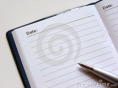Open diary with pen Stock Photo