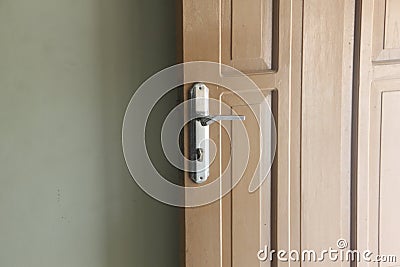 Open door, door handles and a wall Stock Photo
