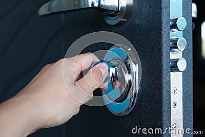 Open door of a family home. Close-up of the lock with your keys on an armored door. Security. Key cylinder, close up Stock Photo