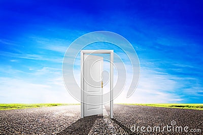 Open door on long empty asphalt road towards sun. Stock Photo