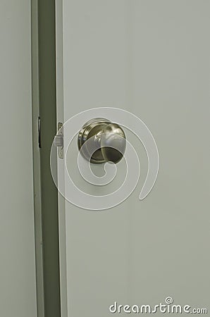 A open door with a oval silver knob Stock Photo