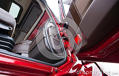 Open door of red semi truck with luxury brown interior Stock Photo