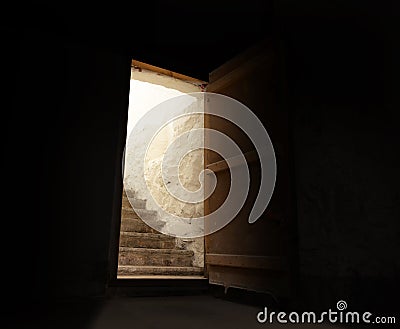 Open door in spooky dark basement Stock Photo