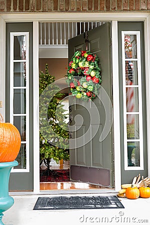 Open doorway to an inviting Christmas scene Stock Photo