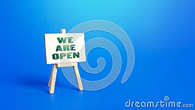 We Are Open easel sign. Exit from severe quarantine conditions, economic and business recovery. Return to normal life. Adaptation Stock Photo