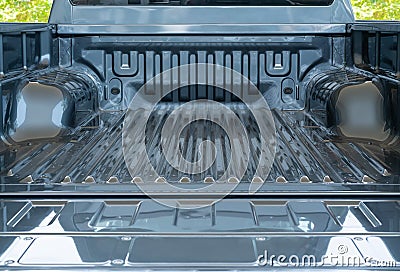Open empty back of pickup truck : silver rear truck on green leaves background Stock Photo
