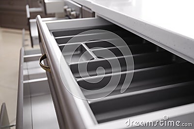 Open empty kitchen drawer, closeup Stock Photo