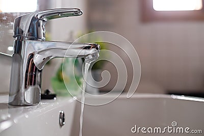 Open faucet washbasin with low water pressure Stock Photo