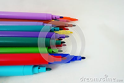 open felt-tip pens on a white surface Stock Photo