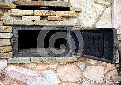 Open forged door blew a large oven Stock Photo