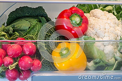 Open fridge filled with fruits and vegetables Stock Photo