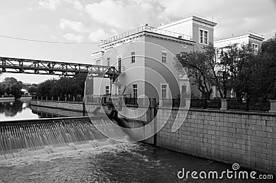 Open gateway on river black and white Stock Photo