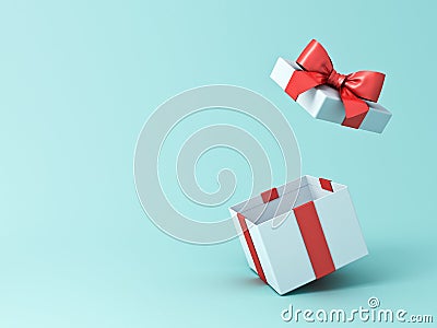 Open gift box or present box with red ribbon and bow isolated on green blue pastel color background Stock Photo