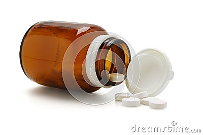 Open glass bottle and spliied tablets Stock Photo