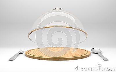 Open glass dome on wooden plate with spoon and fork Stock Photo