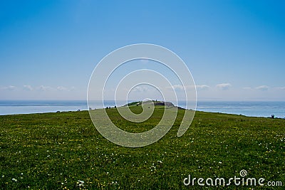 Open green expanse to the sea Stock Photo