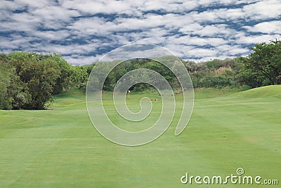 Open Green Golf Fairway Blue Sky and Clouds Stock Photo