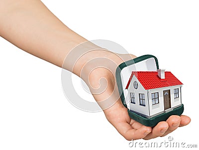 Open green ring box with house in humans hand Stock Photo