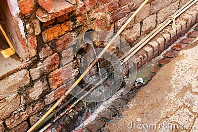 Open gutter waste water system in Fatehpur Sikri, India Stock Photo