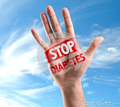 Open hand raised with the text: Stop Diabetes on sky background Stock Photo