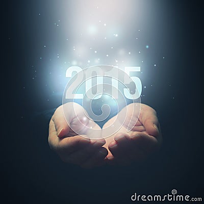 Open hands holding number 2015. Happy New Year. Stock Photo