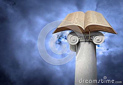 Open holy bible on ancient ionic column pillar post Stock Photo