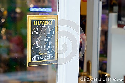 Open hours french sign board on door entrance shop restaurant cafe store clock signboard Stock Photo