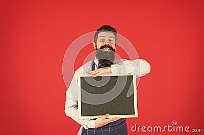 Open hours. Hipster bartender show blackboard copy space. Hipster restaurant staff. Hipster informing you. Man bearded Stock Photo