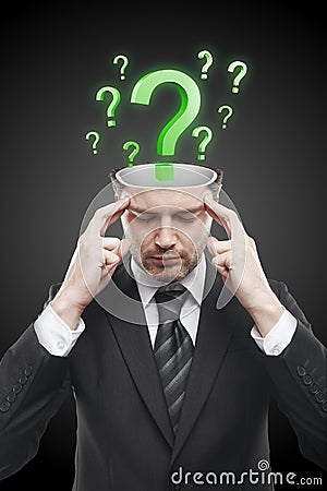 Open minded man with Green question marks inside Stock Photo