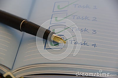 Open notebook with black fountain pen. Stock Photo