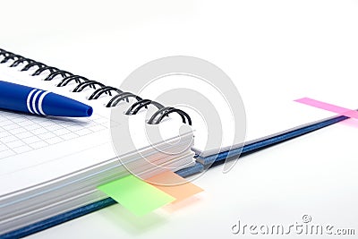 Open notebook with blue pen and color bookmarks Stock Photo