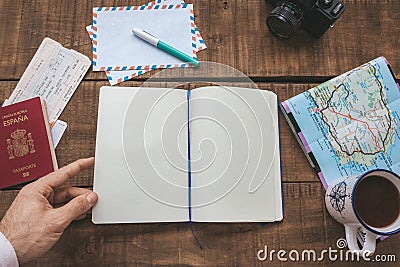 Open notebook on a table to plan a trip Stock Photo