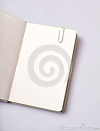 Open notepad blank page on white table Stock Photo