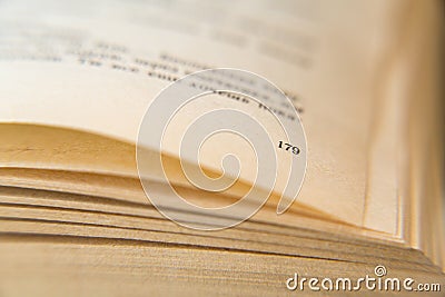 Open old book. Yellowed pages. Page number 179. Paper texture. Macro Stock Photo