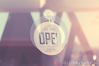 WE ARE OPEN - Open sign broad on a glass door Filtered image processed vintage effect Stock Photo
