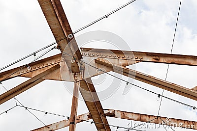 Open overhead girders and trusses covered in rust Stock Photo