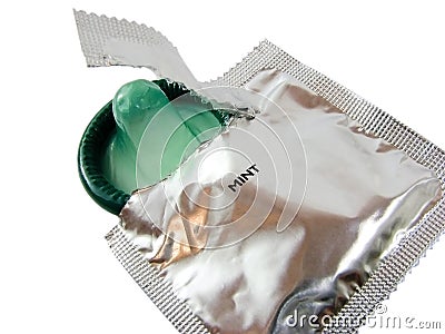 Open pack of condom isolated on white Stock Photo