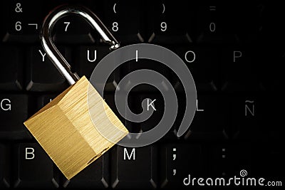 Open padlock on a black computer keyboard Stock Photo