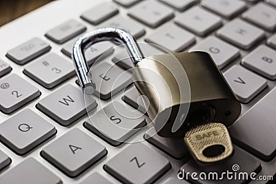 Open lock with word SAFE on key on keyboard Stock Photo