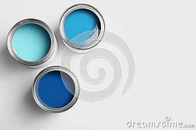 Open paint cans on white background, top view Stock Photo