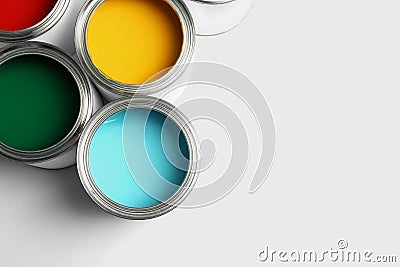 Open paint cans on white, top view. Space for text Stock Photo