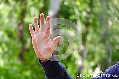 Open palm with spread fingers hand sign. Gesture mens hand of number or gives five. Concept of greeting, openness. Close Up view Stock Photo