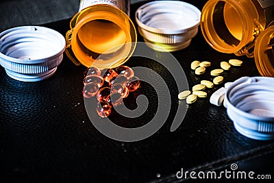 Open pill bottles capsules and pills pharmaceutical big pharma health care medicine Stock Photo